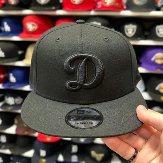 New Era Los Angeles Dodgers "Cursive D" Black/Black 9FIFTY Snapback