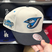 Toronto Blue Jays Creme/Black A-Frame Mitchell & Ness Snapback | Blue Under Brim - Product Image