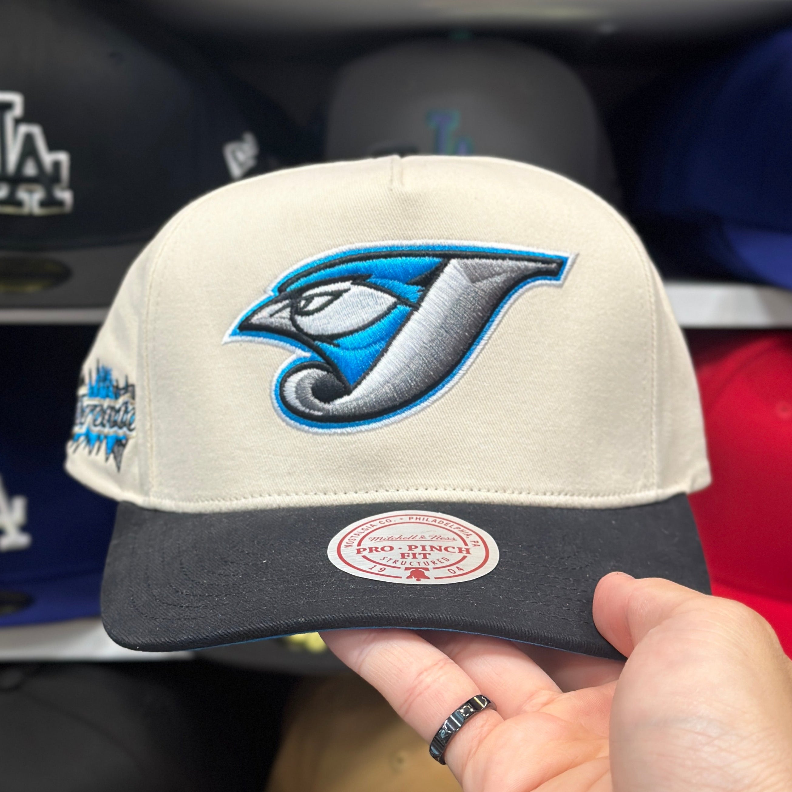 Toronto Blue Jays Creme/Black A-Frame Mitchell & Ness Snapback | Blue Under Brim - Product Image