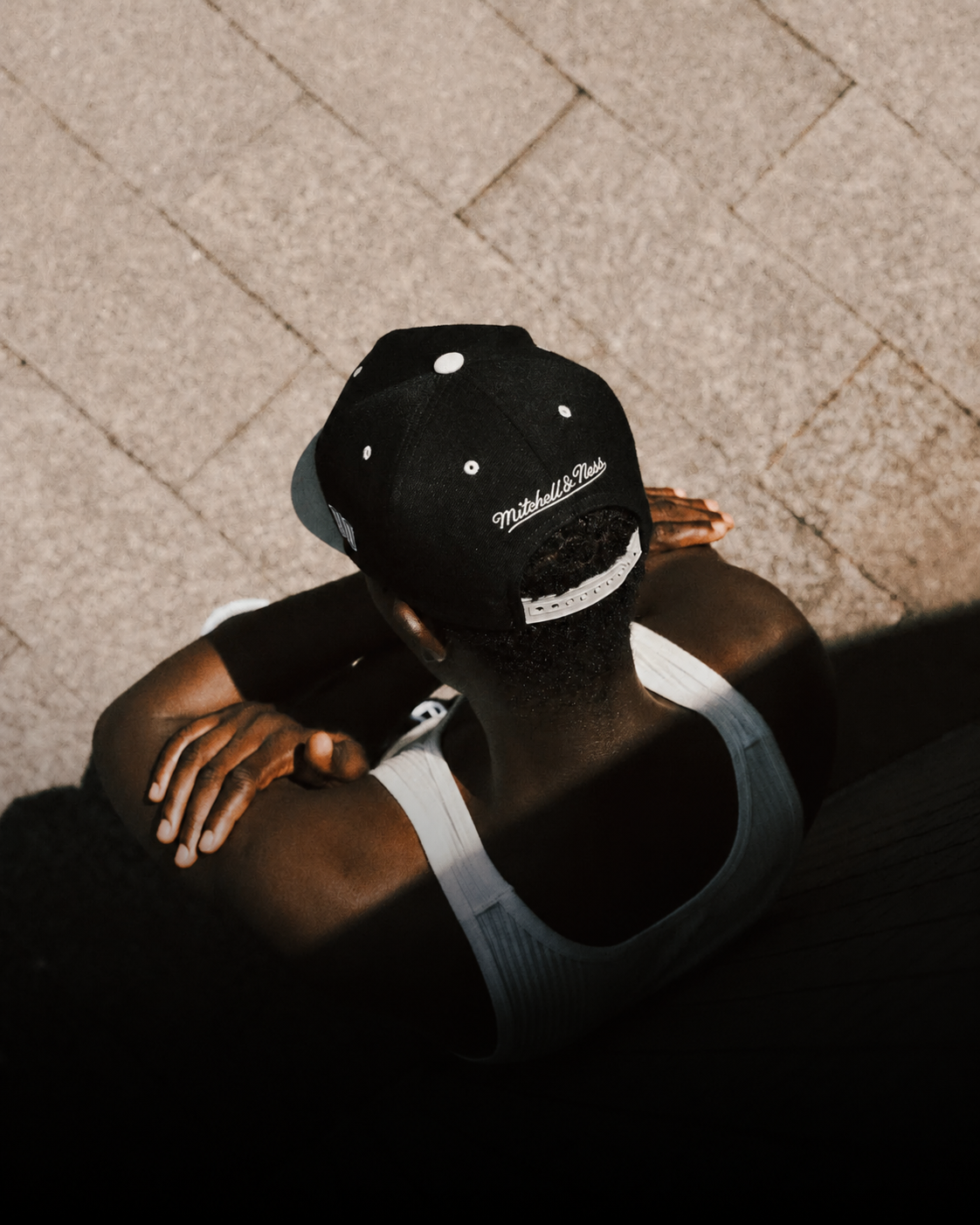 Sunlit_Contemplation_on_Stone_Pavement.png