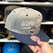 New Era Georgetown Hoyas NCAA Silver/Navy 9FIFTY Snapback - Product Image