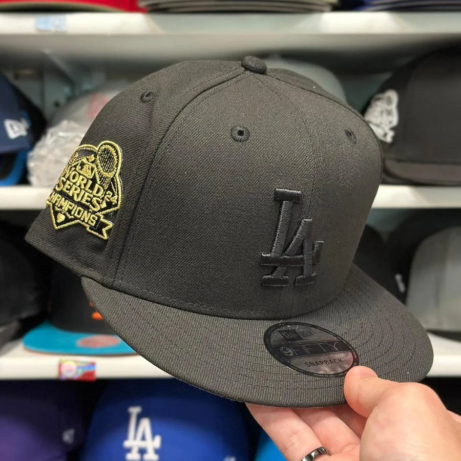 New Era Los Angeles Dodgers '2024 World Series Champions' Black/Gold 9FIFTY Snapback - Product Image