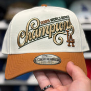 New Era Los Angeles Dodgers '2025 World Series Champions' A-Frame Creme/Earthy Brown 9FORTY Snapback - Product Image